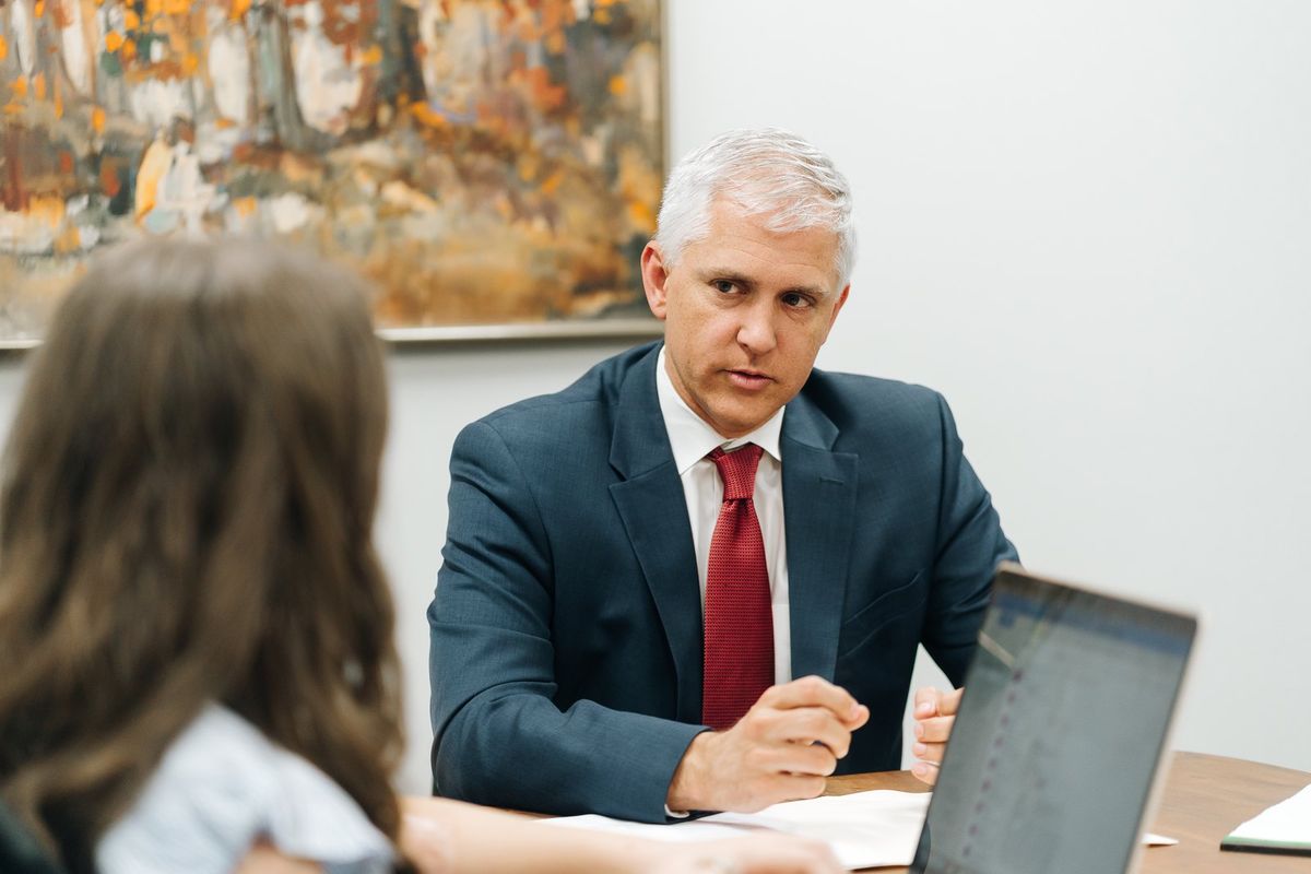 Chad Mooney meeting a client at PLDR Law in Lynchburg