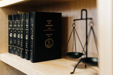 Scales of justice and law books at PLDR Law