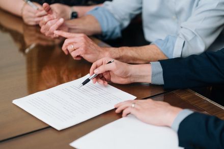 A client signing documents at PLDR Law